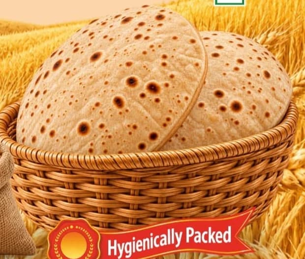 Soft whole wheat rotis in a wicker basket